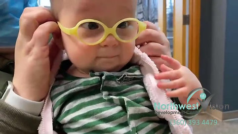 Baby tries glasses on for the first time.