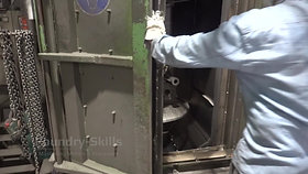 Hangers in a blast cleaning chamber