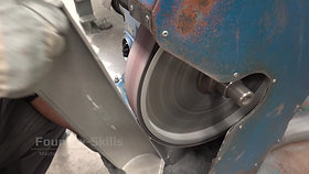Flash removal with belt grinder