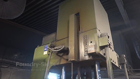 Side view of a vertical tilt casting machine
