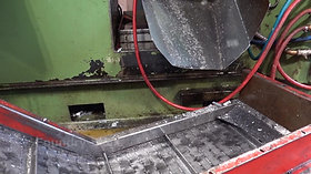 Conveyor belt beneath hot chamber high pressure die casting machine