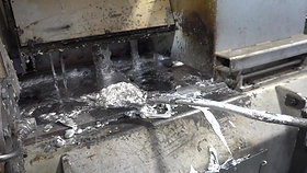 Melt cleaning of a zinc hot chamber high pressure die casting machine